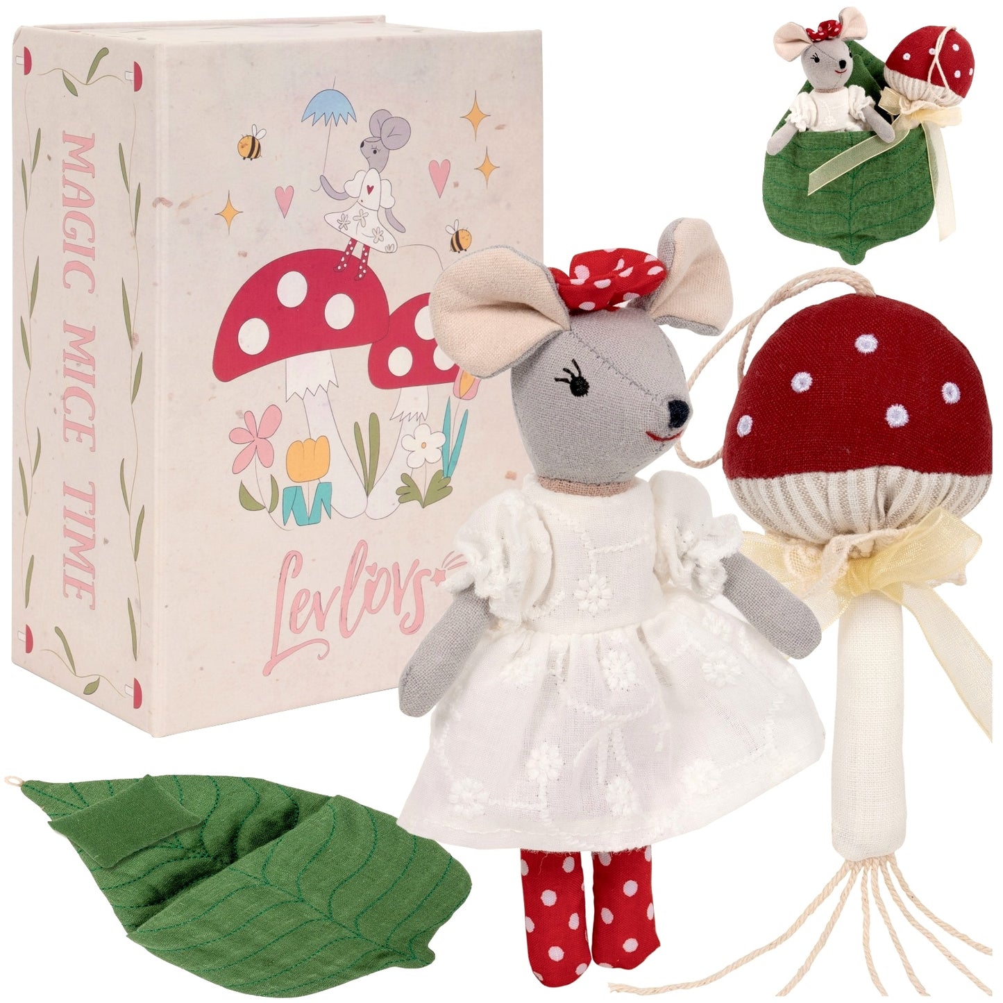 A toy mouse with a white dress and red polka dots standing next to a red and white mushroom with a leaf and a sunlit forest background illustrated on the packaging.